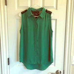 Green sleeveless button up shirt
